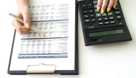 Top view of business woman's hands on table sheet. Finance and business concept.