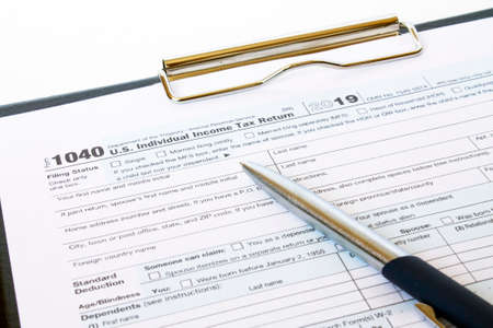 US tax form 1040 with a silver penの写真素材