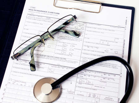 Prescription form lying on table with stethoscope and silver glasses. Medicine or pharmacy concept.