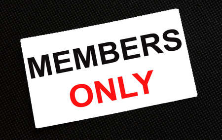 White card on the black background with text Members Onlyの写真素材