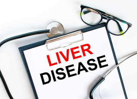 Text Liver Disease in the folder with the stethoscope and glasses. Medical concept photoの写真素材
