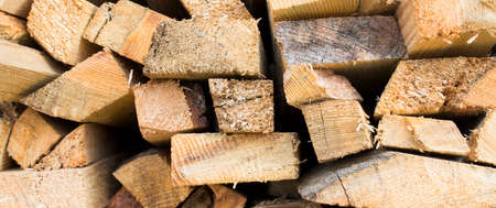 Wall firewood. Background of dry chopped firewood logs in a pile. Can be use as backroundの写真素材