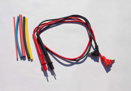 Heat-shrink and electrical wires tubing on a white background. Industrial and electricity