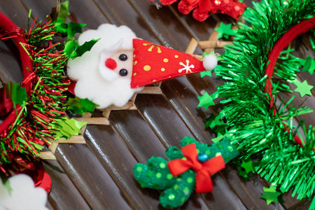 Red Green Colorful Christmas Decoration on Wooden Bamboo Table Close Upの写真素材