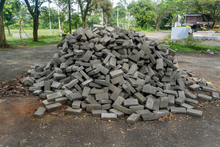 Pile of gray concrete bricks in the middle of a city park construction close upの写真素材