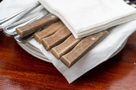 Cutlery on a wooden table inside the cafe close upの写真素材