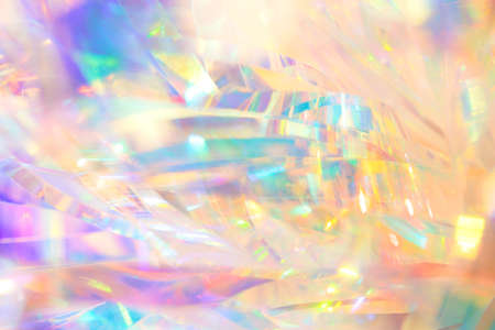 Rich vibrant polished elegant abstract background texture of holographic holiday foil ribbon...