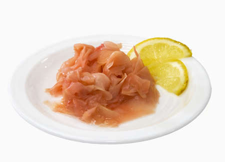 ginger on the white plate with lemonの写真素材