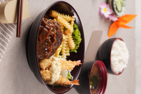 Plate with delicious japanese food on table, closeupの写真素材
