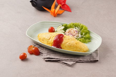 Omelet with salad and cherry tomatoes on gray background, horizontalの写真素材
