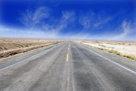 Desert Highway:Road travelling through a desert Field(1)