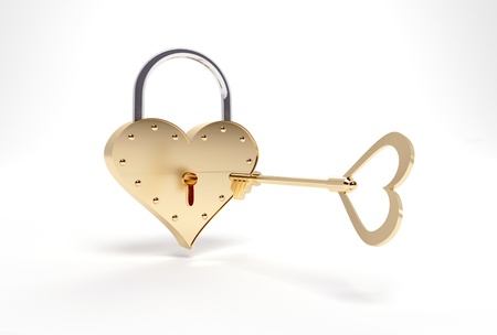 Gold key and the lock in the form of heartの写真素材