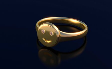 Gold ring with smile on the black backgroundの写真素材