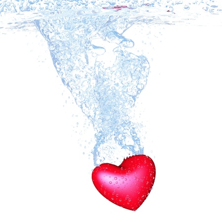 heart dropped into water over white backgroundの写真素材