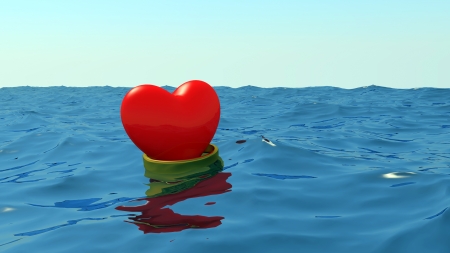 Hearts in gold wedding rings float at the ocean on a meeting each other.の写真素材