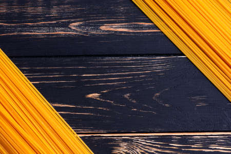 Long pasta on a dark wooden background niceの写真素材