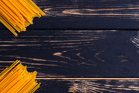 Long pasta on a dark wooden background niceの写真素材