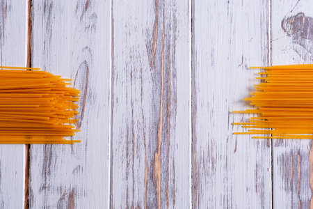 Long pasta on a white wooden background nice