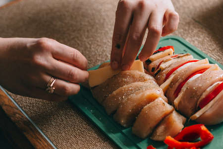 Cooking chicken french with vegetables on baking tray.の写真素材