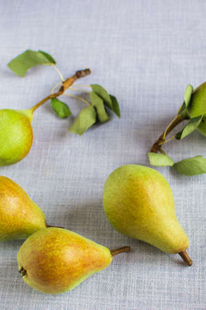 pears in a plate and slices of pears top view. wooden background with pears niceの写真素材