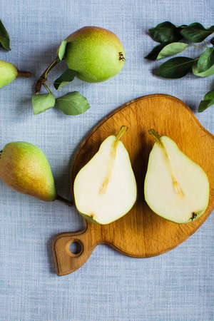 pears in a plate and slices of pears top view. wooden background with pears niceの写真素材