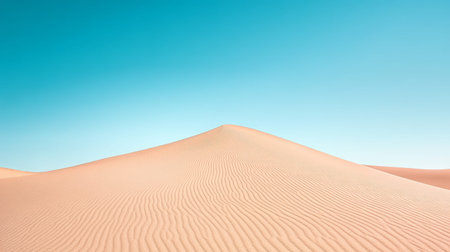 Golden sand dunes of the Sahara stretch across the landscape, contrasting beautifully with a clear blue sky, creating a tranquil and inviting environment.の素材