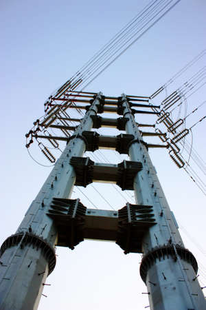 an electrical wire tower and the blue sky