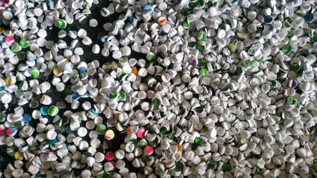 Round paper scrap from drilling the paper.