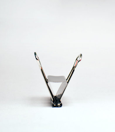 Close up of black paper clip, Bulldog clip for office stationery, Isolated on white background.