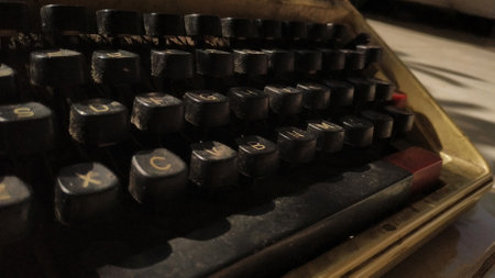 Detail of an old typewriter set on the floor. Retro machine technology. focus selection.の写真素材