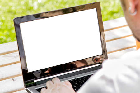 Man working outdoors with laptop