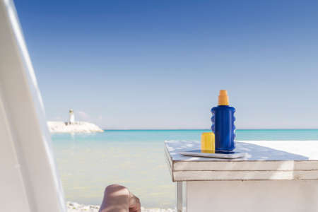 Young woman sunbathing at the beachの写真素材