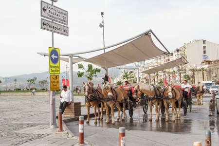 Izmir, Turkey - April 20, 2016:On the seaside of Izmir, many horse carriages serve for...