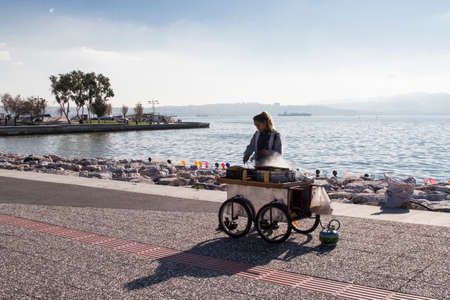 Izmir, Turkey - December 31, 2017:Coastal side of Izmir is a good walking and cycling area especially for young people and families at weekends. There are also many peddler on this beach.のeditorial素材
