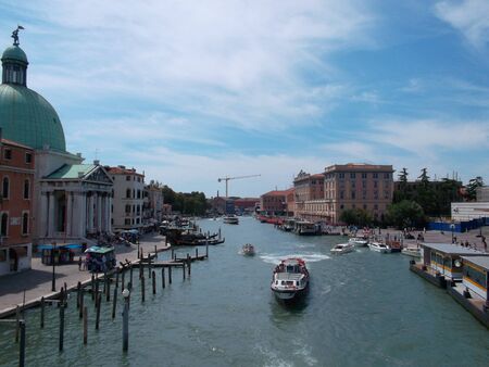 A boat is docked next to a body of waterundefinedの写真素材
