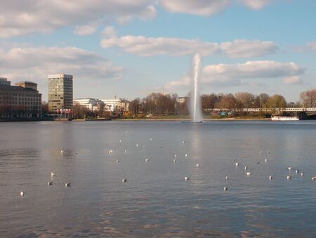 A large body of water with a city in the backgroundの写真素材
