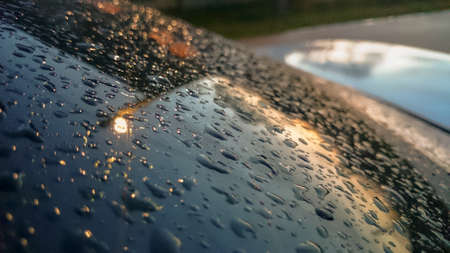 Many of raindrops stuck on the windshield background. Abstract of raindrops on the mirror made with color filtersの写真素材