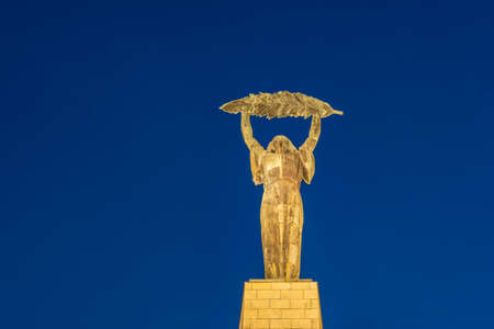 The Liberty Statue or Freedom Statue at night on the Gellert Hill in Budapest, Hungary. It commemorates those who sacrificed their lives for the independence of Hungaryのeditorial素材