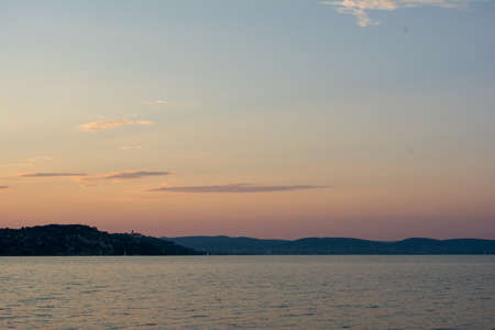 Beautiful sunset above the lake Balatonの写真素材