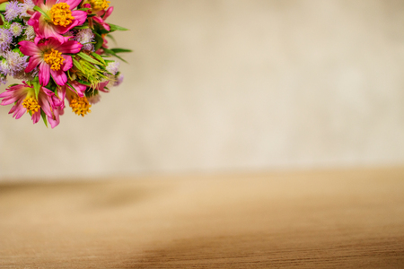 Blank Space of Brown Wood Background With Round Bouquet on Top Sideの写真素材