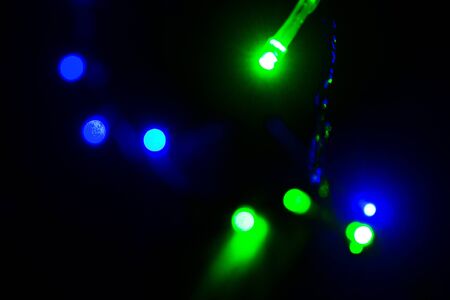 Bright turquoise green blue blurred light on night