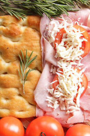 prosciutto baked pizza dough with tomato and mozzarellaの写真素材