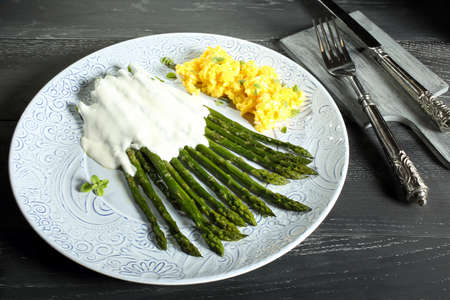 cooked asparagus with cheeseの写真素材