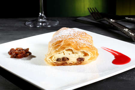dessert strudel with cheese and fruit green backgroundの写真素材