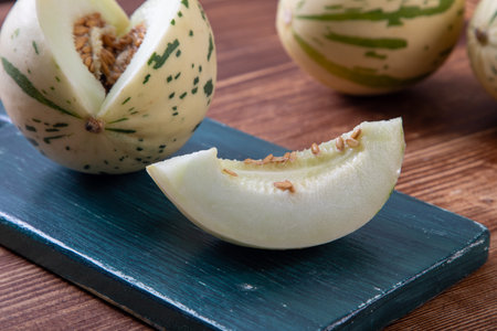 cantaloupe melon on a wooden background, close upの写真素材