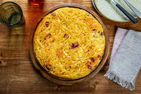 Spaghetti carbonara with bacon and cheese on a wooden background.の写真素材