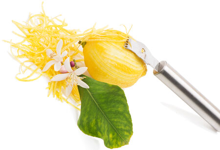  Blossom,  lemon zest with zester isolated on a white background