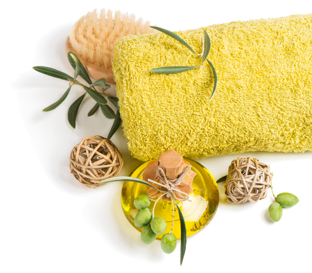 Top view of aroma olive oil, towel and scrub brush isolated on a white background.の写真素材