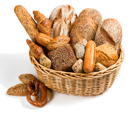 Bread assortment in a basket  isolated on a white background.の写真素材