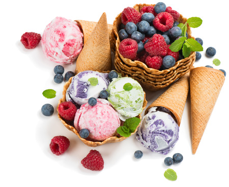 Top view of marble ice cream of berry (blueberry, raspberry) in a wafer basket and cones and fresh berries isolated on a white background.の写真素材